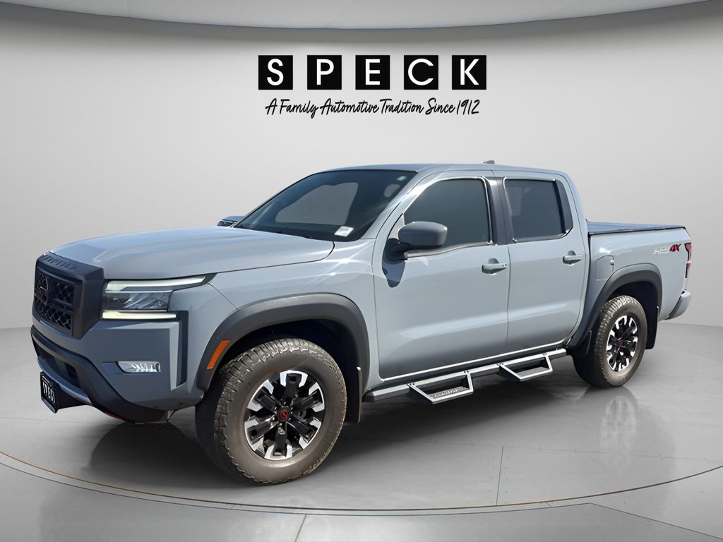 2023 Nissan Frontier Crew Cab PRO-4X 4x4 in Boulder Gray Pearl — front three-quarter view